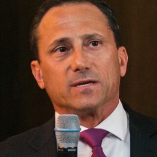 Peter Tannenbaum founder of Ramax Search and Staffing speaking at a financial services industry event