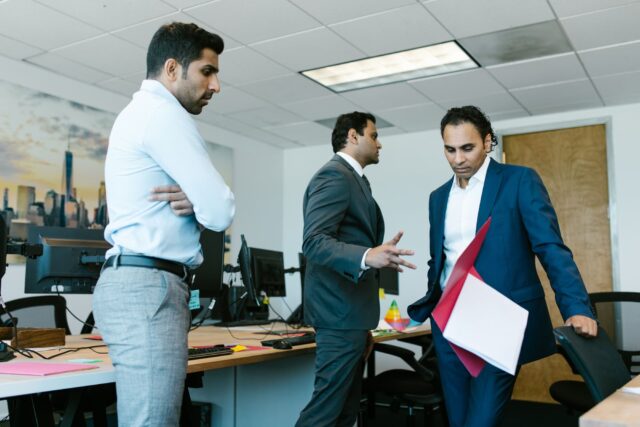 Financial services professionals dealing with difficult workplace dynamics and team tension in office