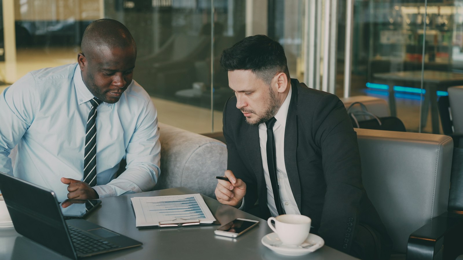 Wealth management professionals reviewing financial charts